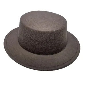 Macro texture of dark brown flat-top wool felt boater hat with wide stiff brim
