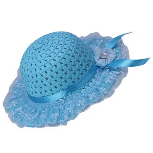Detail of light blue straw sun hat with breathable lace trim and flower ribbon
