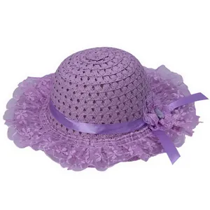 Detailed macro view of purple woven sun hat with delicate lace trim and floral ribbon