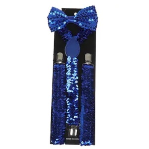 Close-up of sparkling electric blue sequin bowtie and elastic suspenders with metal clips