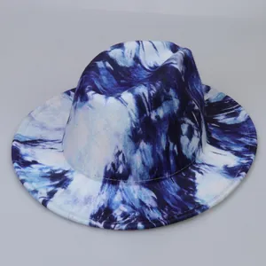 Close-up of blue and white tie-dye fedora hat showing fine stitching and wool texture