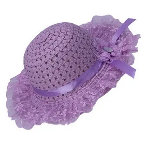 Detail of purple straw hat with lace brim and elegant ribbon flower with rhinestone