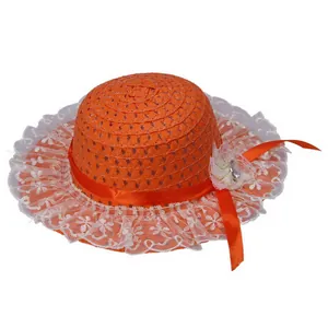 Detail of orange kids straw hat featuring white lace trim and a sparkling mesh flower