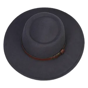 Close-up of classic wool felt boater hat with leather band and vintage metal buckle