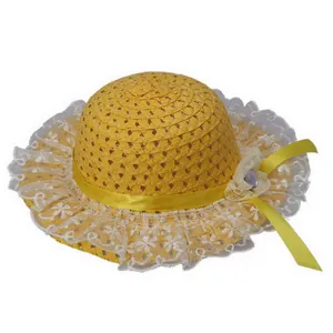 Detailed close-up of kids straw sun hat featuring yellow ribbon bow and white lace trim