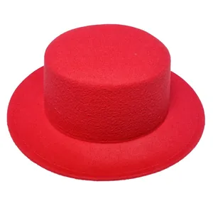 Top view of bright red wool felt boater hat showing stiff flat brim and smooth texture