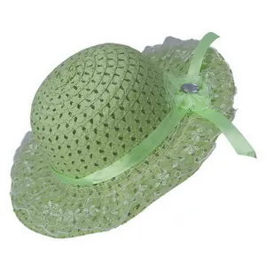 Detail of light green woven straw sun hat with delicate white lace trim and mesh flower
