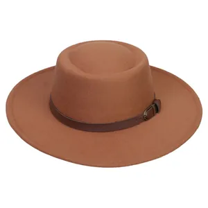Detail of camel wool felt boater hat with a dark brown faux leather band and metal buckle