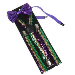 Detail of purple, green, and gold sequin bow tie and suspenders set on black display card
