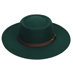 Close-up of dark green wool felt boater hat with a brown leather band and metal buckle