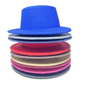 Close-up of stacked wool felt fedora hats in a wide variety of vibrant colors