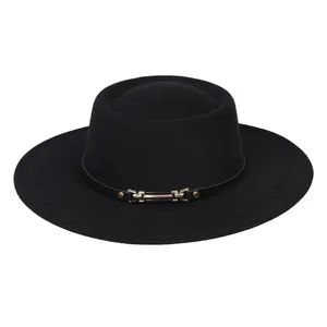 Close-up of black wool felt fedora featuring a decorative leather band and gold buckle