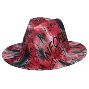 Detail of red and black tie-dye fedora with graffiti text print and large brim