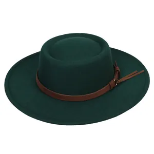 Detail view of the dark green felt fedora hat with a brown leather decorative band