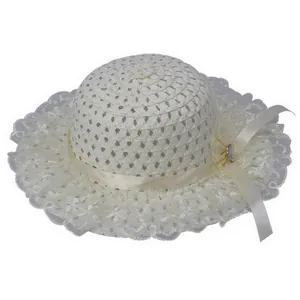 Detail of children's straw hat with intricate geometric weave and elegant lace brim