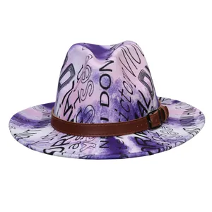 Detail of purple and white tie-dye wool fedora with black graffiti and leather belt