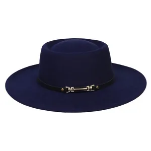 Detailed shot of dark blue wool felt boater hat with black leather band and gold buckle