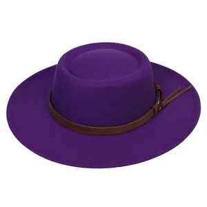 Close-up of bright purple fedora hat with brown leather band and gold buckle detail