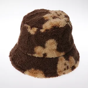Bob d'hiver en polaire de laine avec motif nuage marron et beige et doublure chaude