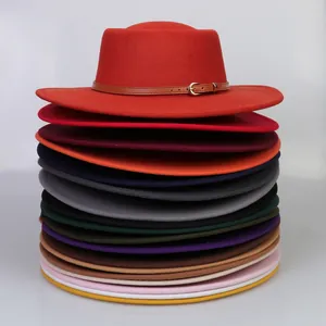 Vertical stack of colorful wool felt fedora hats with stylish leather band and buckle details
