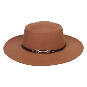 Detail of tan flat top wool fedora hat featuring a thin black band and gold metal buckle