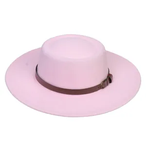 Close-up of pink wool boater hat with a brown leather belt and bronze buckle detail