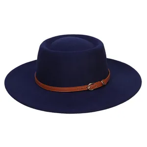 Detail of navy wool felt fedora featuring a brown leather strap and gold metal buckle