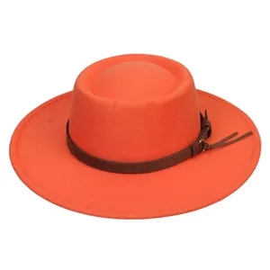 Detail of orange wool fedora featuring a brown leather band and metallic buckle trim