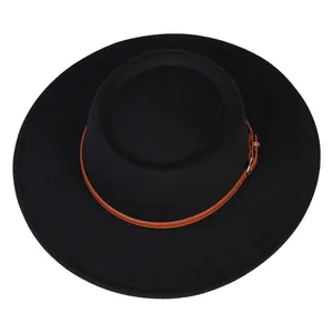 Close-up of the black felt fedora hat featuring a brown leather strap and gold buckle