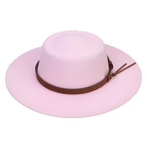 Detail view of pink wool felt boater hat with a brown faux leather belt and metal buckle