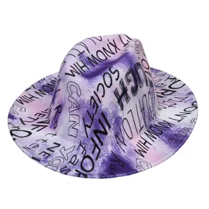 Detail view of purple and pink tie-dye fedora hat with black graffiti letter prints