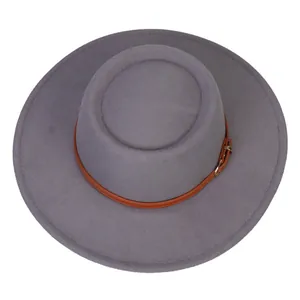 Top view of dark grey wide brim fedora with brown faux leather band and gold buckle