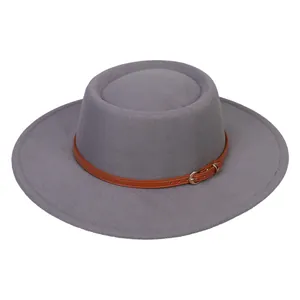 Detail of grey felt boater hat featuring a brown leather band and gold metal buckle