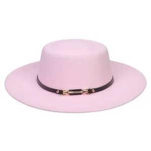 Detail of pink wool felt flat top hat with black leather band and gold buckle