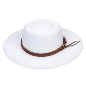 Detail view of a white wide brim boater hat with brown leather band and gold buckle