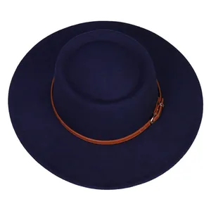 Detail of navy wide-brim felt hat with brown leather band and golden metal buckle