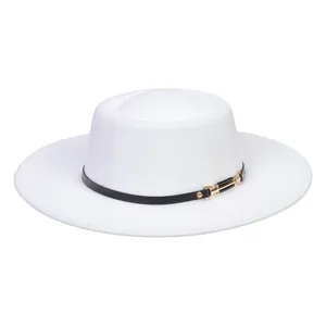 Detail of white flat-top wool felt hat featuring black leather band and gold metal buckle