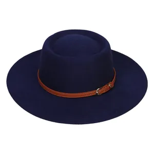 Detail of navy wide-brim wool fedora with brown leather strap and silver buckle accent