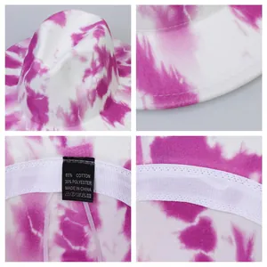 Pink and white tie-dye fedora hat with wide brim showing interior and material details