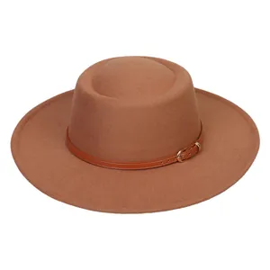 Detail of camel wool felt fedora with a brown leather decorative band and metal buckle
