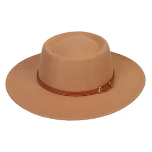 Close-up of brown wool felt fedora featuring a slim leather band with a golden buckle