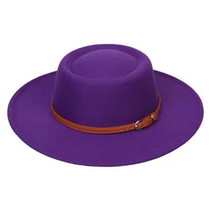 Detail of dark purple wool fedora hat featuring a brown leather belt with a metal buckle