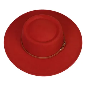 Detailed top view of red felt boater hat featuring a brown leather band and buckle
