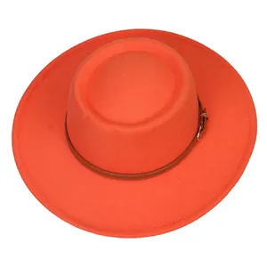 Detail of bright orange wool fedora with brown leather belt and metal buckle