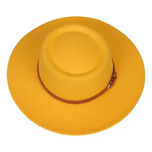 Vertical top view of yellow felt fedora hat with brown leather belt and golden buckle