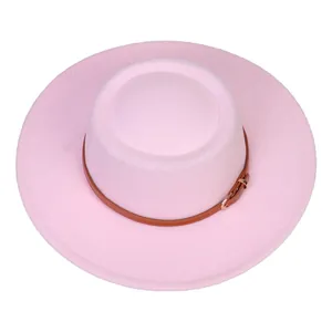 Detail of light pink felt fedora with brown leather strap and gold metal buckle