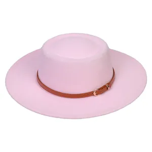Detailed macro view of pink felt boater hat with brown leather band and gold buckle