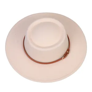 Top view of cream fedora hat with brown leather band and gold buckle detail