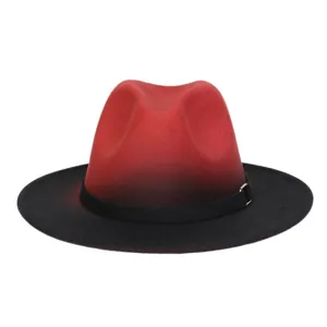 Detail of red and black gradient wool fedora hat with elegant gold metal buckle