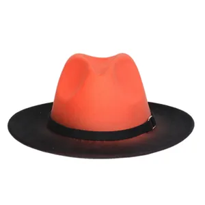 Detail of the vibrant orange crown and black brim fedora with a buckled decorative band